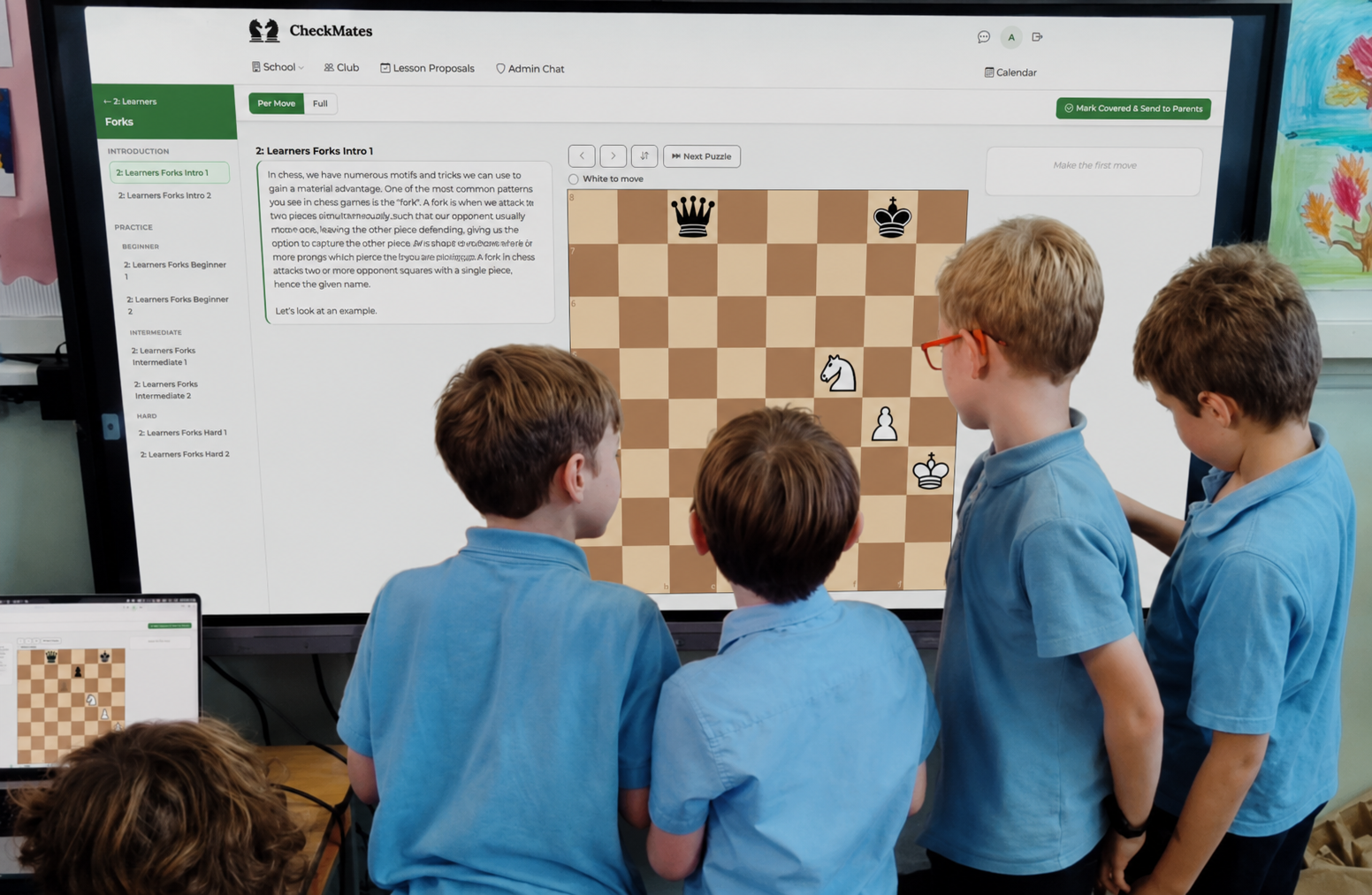 Students in a school-run chess club using the CheckMates platform